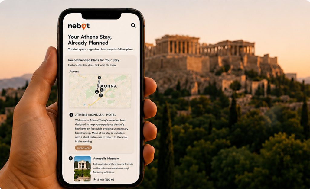 Phone showing an Athens plan in front of the Acropolis